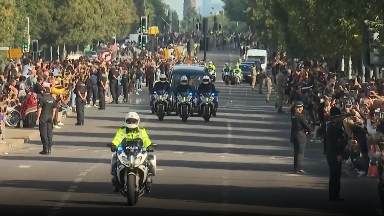 Crowds watch as the Royal Hearse travels to Windsor.