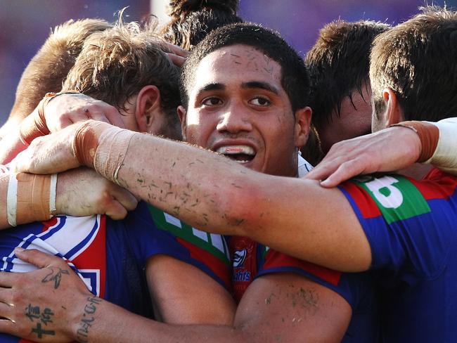 Sunday Telegraph. NRL Round 1; Newcastle Knights v New Zealand Warriors, played at Hunter Stadium in Newcastle. L to R, Knights' Sione Mata'utia in a huddle celebrating teammate Tyler Randell's 2nd half try.