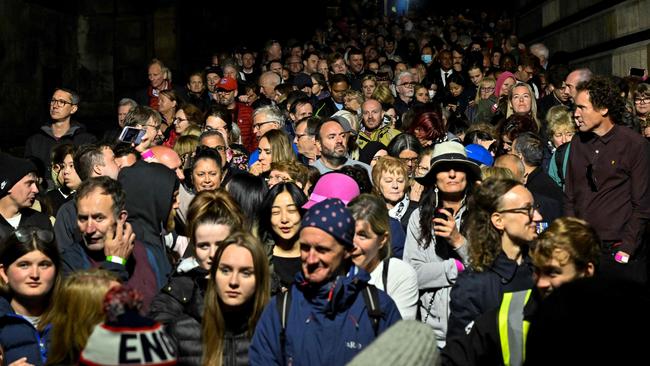 Members of the public queue outside St Giles' Cathedral, in Edinburgh to pay their respects.