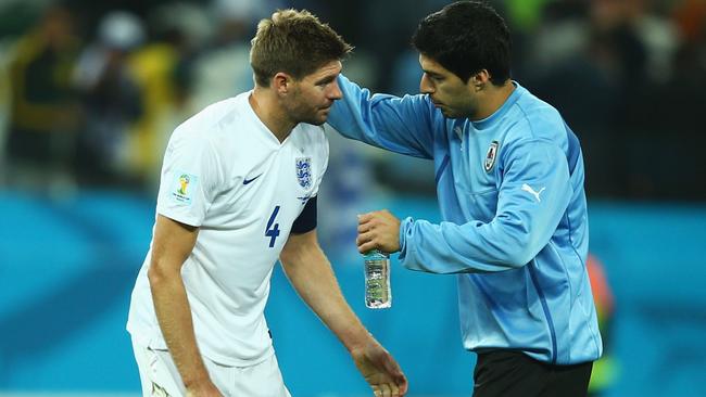 SAO PAULO, BRAZIL - JUNE 19: Luis Suarez of Uruguay consoles Steven Gerrard of England after Uruguay's 2-1 victory in the 2014 FIFA World Cup Brazil Group D match between Uruguay and England at Arena de Sao Paulo on June 19, 2014 in Sao Paulo, Brazil. (Photo by Clive Rose/Getty Images)