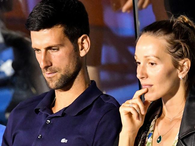 Serbian tennis player Novak Djokovic (L) talks to his wife Jelena during a match at the Adria Tour, Novak Djokovic's Balkans charity tennis tournament in Belgrade on June 14, 2020. - Novak Djokovic has also tested positive for coronavirus on June 23, 2020 along with Grigor Dimitrov, Borna Coric and Viktor Troicki, after taking part in an exhibition tennis tournament in the Balkans featuring world number one Novak Djokovic, raising questions over the sport's planned return in August. (Photo by Andrej ISAKOVIC / AFP)