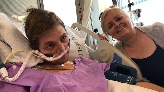 Gareth Aucock was rushed to hospital following an asthma attack, and now spends each day recovering with the help of mum Sue (pictured) and the rest of his family. Photo: Supplied