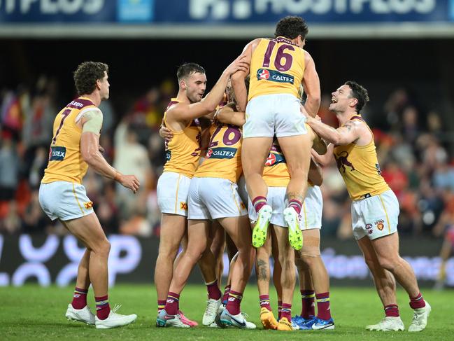 The Lions celebrate victory in the Q Clash. Picture: Matt Roberts/AFL Photos