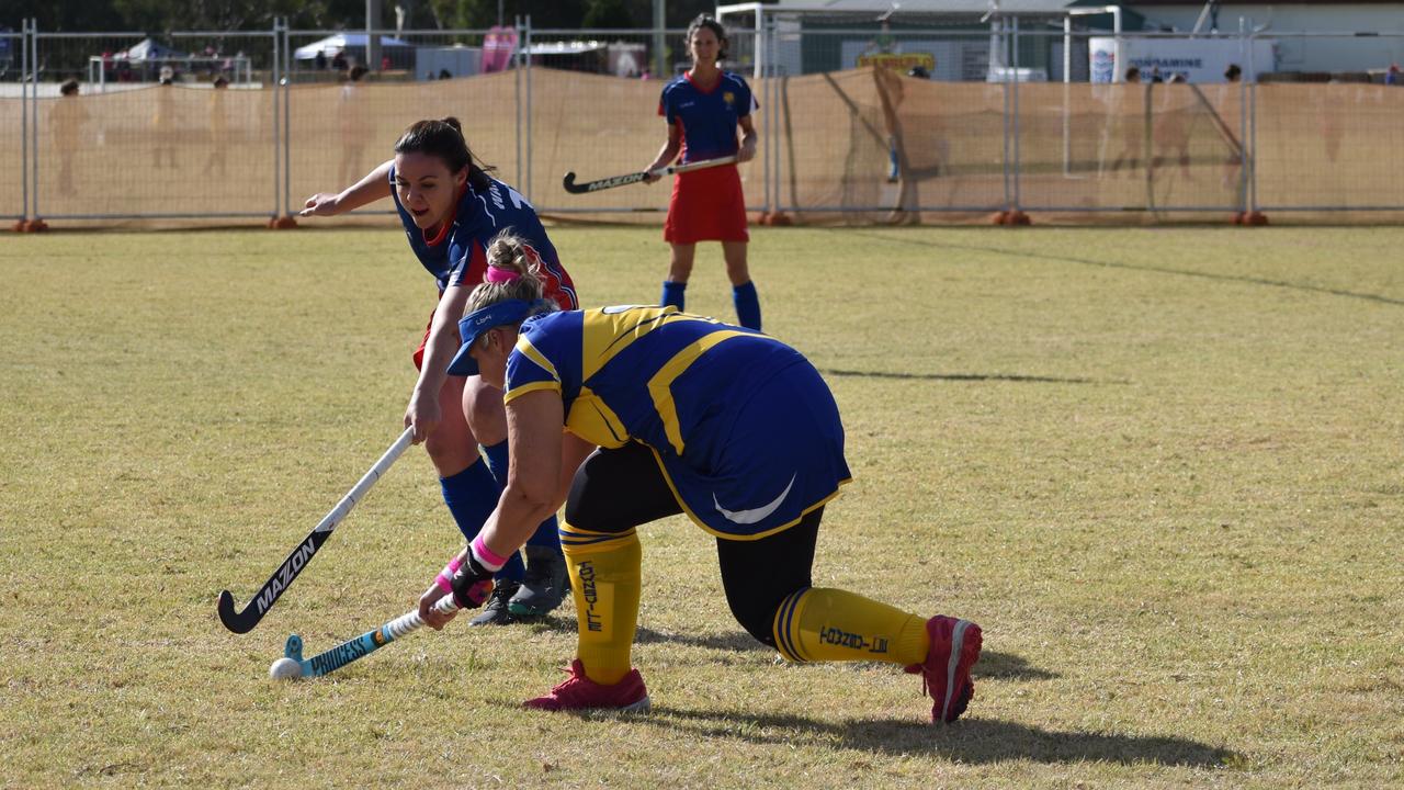 Karina Miles defending the ball for Warwick at the 2021 Queensland Hockey Women's Masters Championship at Queens Park.