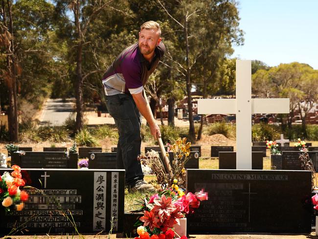 Matthew Johnson at work at Rookwood cemetery, which is advertising for an apprentice groundsperson and grave digger.