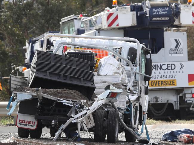 (body is under tarp in image)Traffic chaos on the Western Ring road after a person was killed by a passing crane. Tuesday, September 18. 2018. Picture: David Crosling