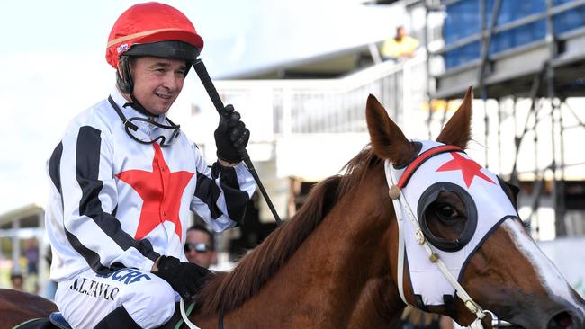 Jockey Jason Taylor suffered serious injuries in a horror barrier accident at Gold Coast races.