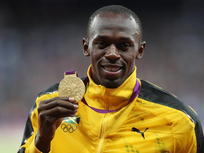 LONDON, ENGLAND - AUGUST 06:  Gold medalist Usain Bolt of Jamaica poses on the podium during the medal ceremony for the Men's 100m final on Day 10 of the London 2012 Olympic Games at the Olympic Stadium on August 6, 2012 in London, England.  (Photo by Clive Brunskill/Getty Images)