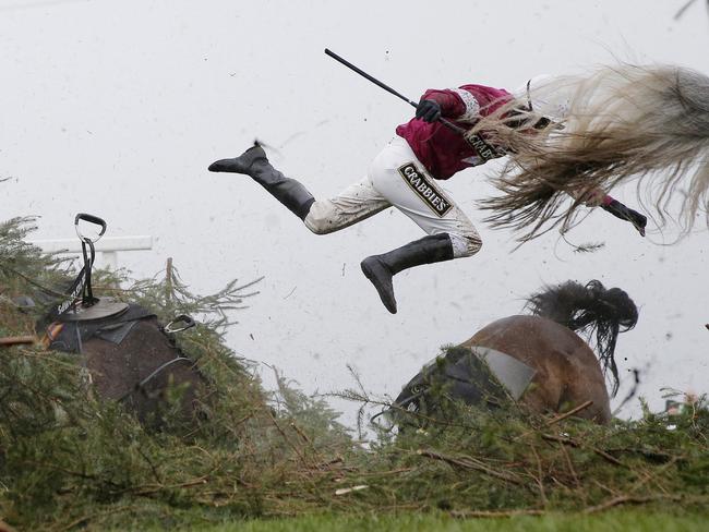 Sports - First Prize, Singles © Tom Jenkins, The Guardian Title: Grand National Steeplechase Jockey Nina Carberry flies off her horse Sir Des Champs as they fall at The Chair fence during the Grand National steeplechase during day three of the Grand National Meeting at Aintree Racecourse on April 9th 2016 in Liverpool, England.