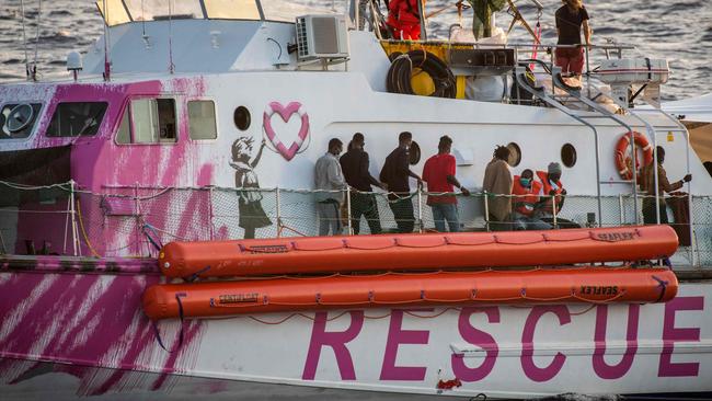 Migrants stand on the Louise Michel, a rescue ship funded by British street artist Banksy. Picture: AFP