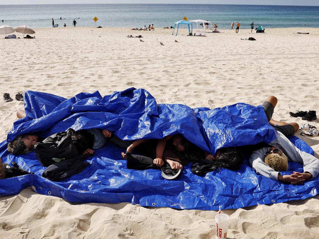 Some NYE revellers at Bondi didn’t make it beyond the beach after ringing in 2025. Picture: Sam Ruttyn