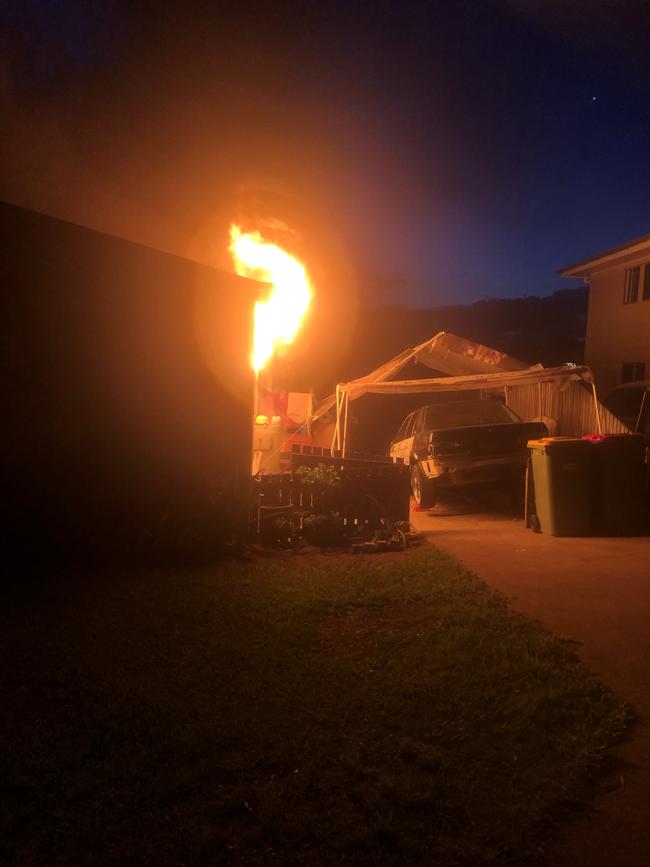 The fire bursts through the window at Stewart Terrace in Gympie on Tuesday night.