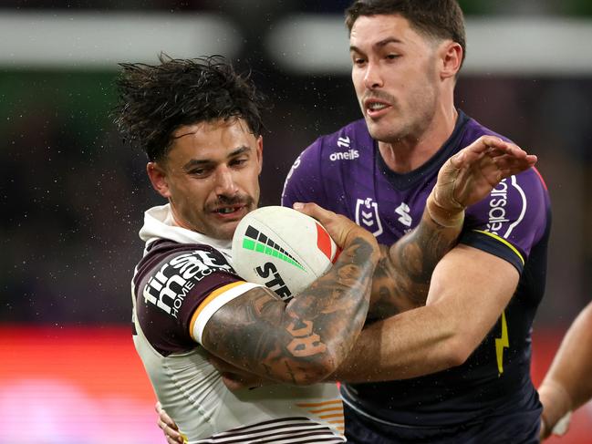 MELBOURNE, AUSTRALIA - APRIL 04:  JesseÃÂ Arthars of the Broncos is tackled by Nick Meaney of the Storm during the round five NRL match between Melbourne Storm and Brisbane Broncos at AAMI Park on April 04, 2024, in Melbourne, Australia. (Photo by Robert Cianflone/Getty Images)