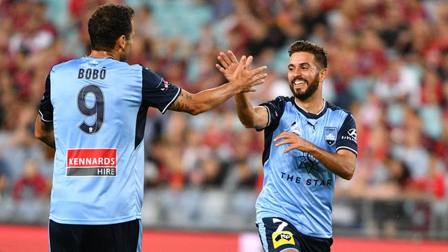 Michael Zullo (right) of Sydney celebrates with teammate Bobo. (AAP Image/Mick Tsikas)