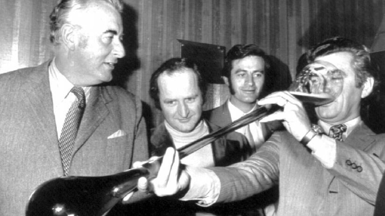 Hawke drinks from a yard glass with Gough Whitlam.