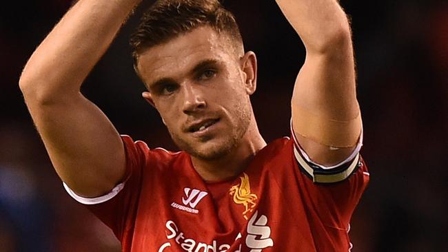 Liverpool's English midfielder Jordan Henderson applauds supporters at the final whistle in the English Premier League football match between Liverpool and Newcastle United at Anfield in Liverpool, north west England on April 13, 2015. Liverpool won the game 2-0. AFP PHOTO / PAUL ELLIS RESTRICTED TO EDITORIAL USE. NO USE WITH UNAUTHORIZED AUDIO, VIDEO, DATA, FIXTURE LISTS, CLUB/LEAGUE LOGOS OR “LIVE” SERVICES. ONLINE IN-MATCH USE LIMITED TO 45 IMAGES, NO VIDEO EMULATION. NO USE IN BETTING, GAMES OR SINGLE CLUB/LEAGUE/PLAYER PUBLICATIONS.