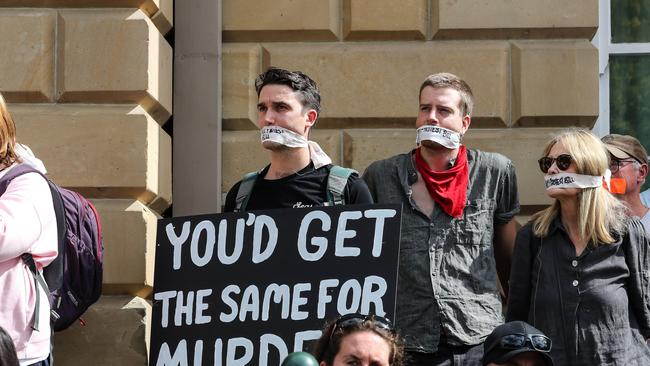 People out the front of state parliament protest against the anti-protest laws. Picture: Zak Simmonds