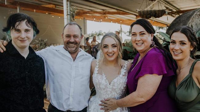 Lachlan Snadden with his dad Brett, older sister Tayla, mum Shelly and younger sister Mia at Tayla’s wedding in December 2021.