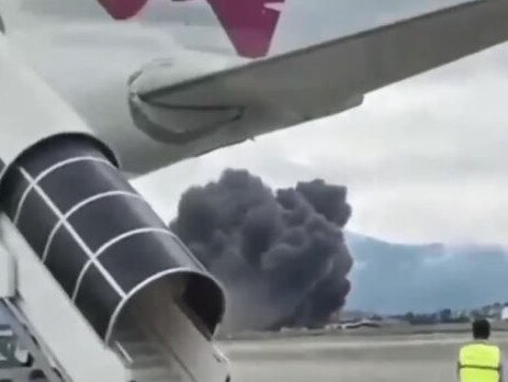 Thick black smoke envelops the area after a jet crashed in Nepal. Picture: Supplied