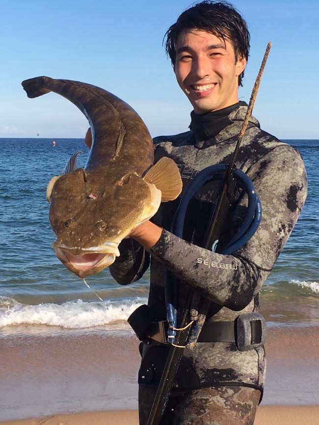 Chris pictured with a Flathead in his spearfishing gear