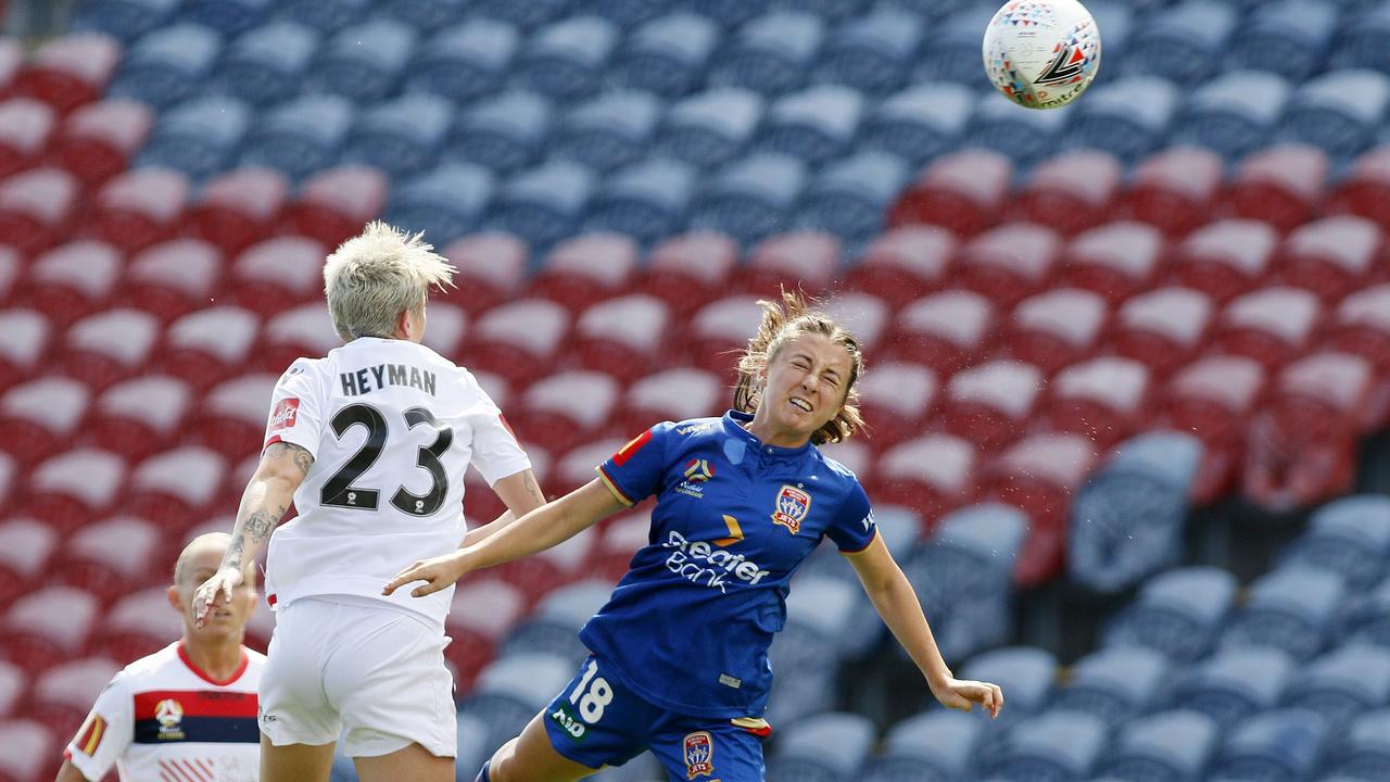 Clare Wheeler heads the ball while playing for the Newcastle Jets.