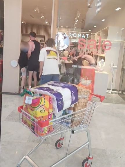 A fight between youths at Tea Tree Plaza spills over into the Mimco store. Picture: TikTok / huri640