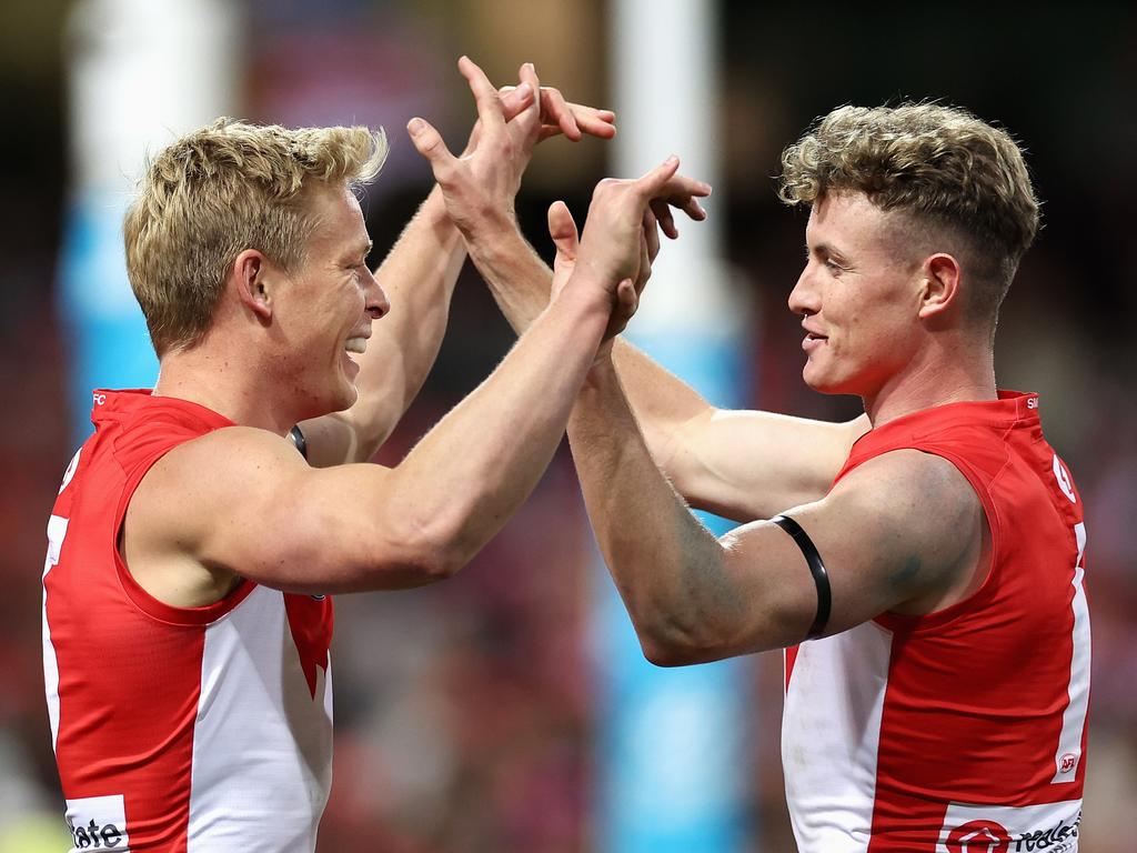 SYDNEY, AUSTRALIA - JUNE 24: IsaacÂ Heeney of the Swans 
celebrates kicking a goal with ChadÂ Warner of the Swans during the round 15 AFL match between Sydney Swans and West Coast Eagles at Sydney Cricket Ground, on June 24, 2023, in Sydney, Australia. (Photo by Cameron Spencer/Getty Images)