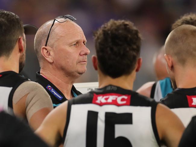 PERTH, AUSTRALIA - APRIL 03: Ken Hinkley, Senior Coach of the Power addresses the team at three quarter time break during the 2021 AFL Round 03 match between the West Coast Eagles and the Port Adelaide Power at Optus Stadium on April 03, 2021 in Perth, Australia. (Photo by Will Russell/AFL Photos via Getty Images)