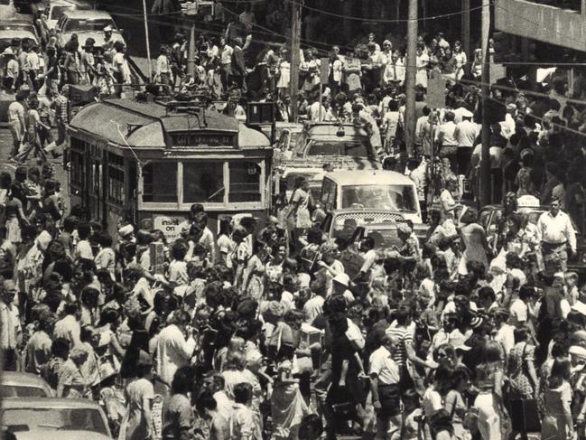 Last minute Christmas shoppers in Bourke Street outside Myer Melbourne in December 1974.