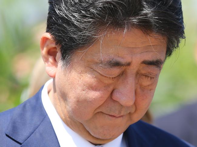 The Japanese PM Shinzo Abe during a ceremony at a memorial for the Japanese submarine I-124 which was sunk by an Australian warship in World War II in Darwin, Northern Territory, Australia, Saturday, November 17, 2018. Mr Abe is in Darwin with wife Akie visiting Australia on an official two day visit to discuss bilateral and international issues with Australian officials. (AAP Image/Reuters Pool, Glenn Campbell) NO ARCHIVING