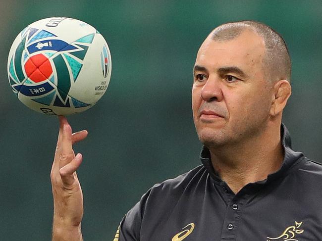 OITA, JAPAN - OCTOBER 18:  Michael Cheika, Head Coach of Australia spins a ball on his finger as Nic White of Australia prepares to pass during the Australia Wallabies Captain's Run ahead of their 2019 Rugby World Cup quarter final against England at the Oita Stadium on October 18, 2019 in Oita, Japan. (Photo by Dan Mullan/Getty Images)