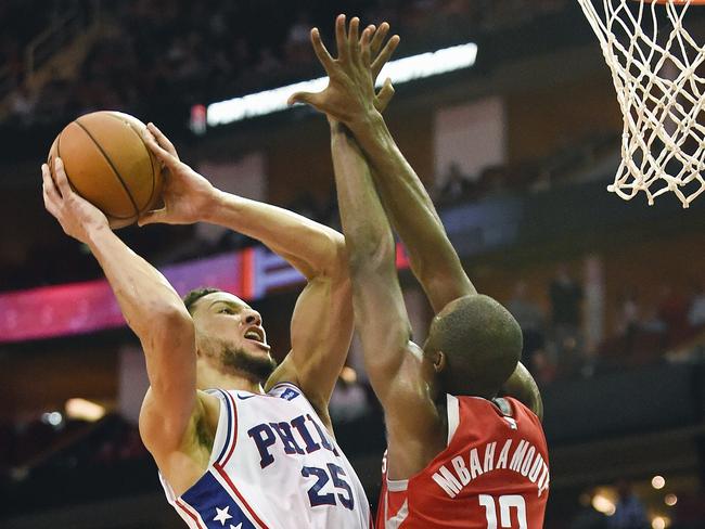 Philadelphia 76ers guard Ben Simmons, left, shoots as Houston Rockets forward Luc Mbah a Moute defends during the second half of an NBA basketball game, Monday, Oct. 30, 2017, in Houston. Philadelphia won 115-107. (AP Photo/Eric Christian Smith)