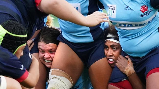 Waratahs gun Sera Naiqama (right) looks on in a scrum.