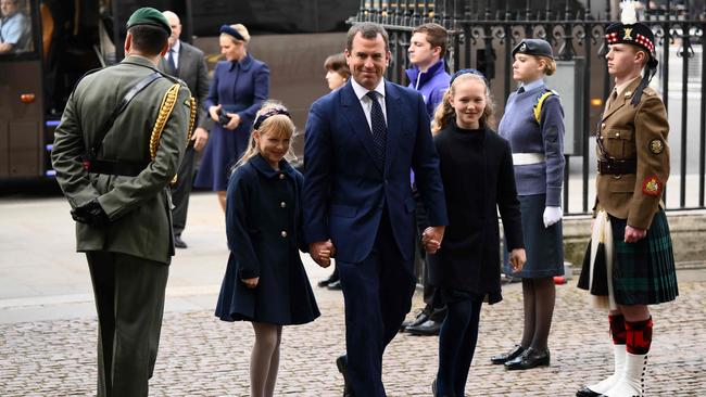 Peter Phillips and his daughters Savannah and Isla arrive to attend the service. Picture: AFP