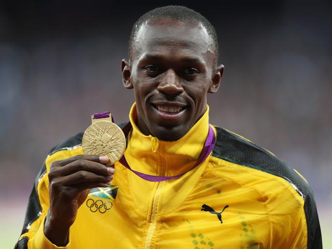 Usain Bolt poses on the podium during the medal ceremony for the Men’s 100m final at the London 2012 Olympic Games on August 6, 2012 in London, England. Picture: Getty