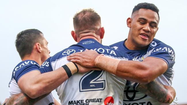 Scott Drinkwater, Kyle Feldt and VIliami Vailea celebrate a North Queensland Cowboys try against Penrith Panthers in Round 17 of the NRL at BlueBet Stadium on June 30, 2024. Picture: NRL Photos