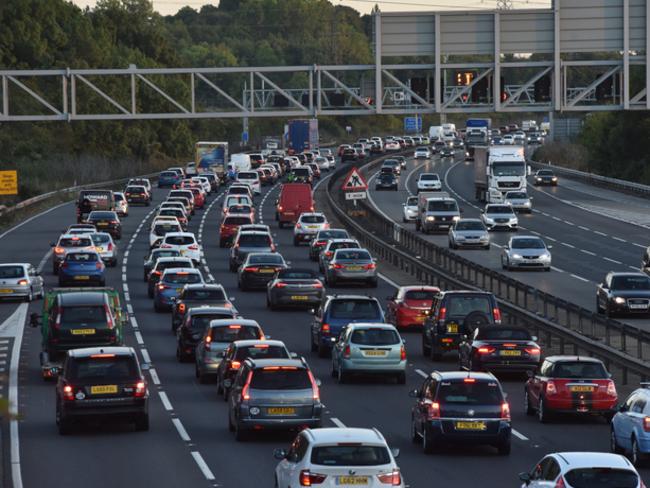 Bedford, UK - October 2nd 2016:Busy traffic on the M1 motorway freeway in England near Toddington Services The M1 is UK’s main roadway from north to south