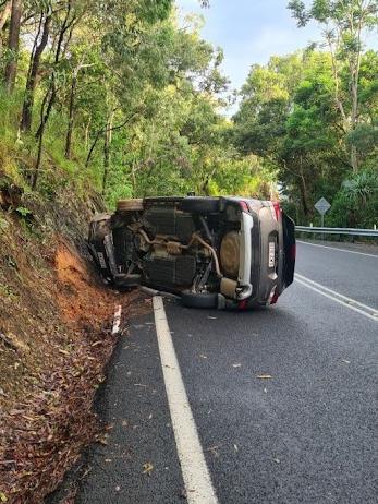 An SUV has rolled after hitting an embankment causing traffic delays on the Captain Cook Highway between Cairns and Port Douglas.