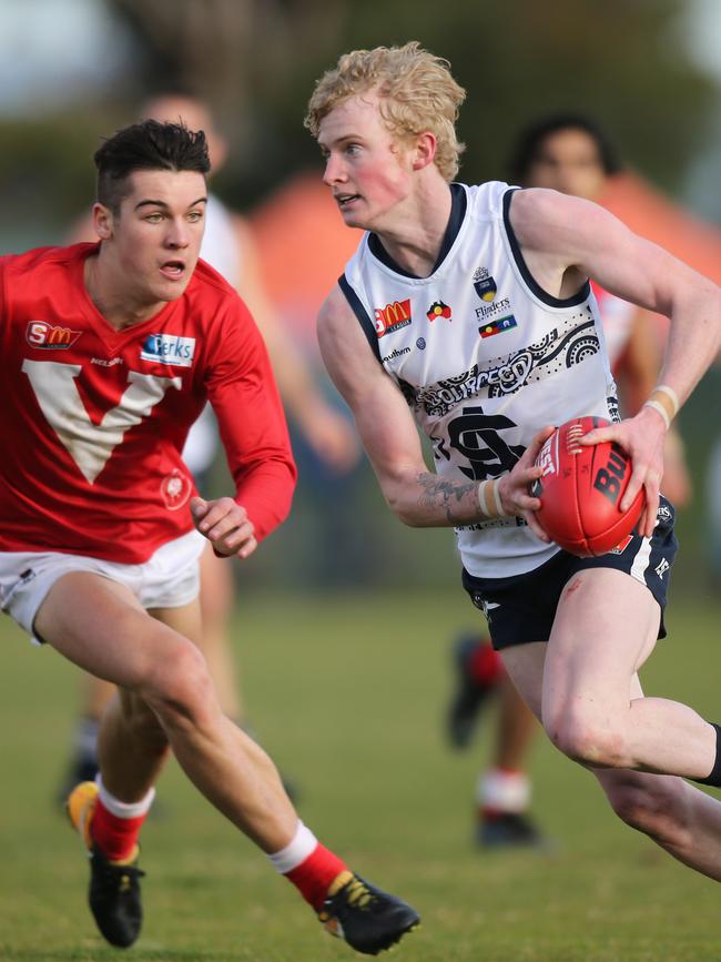 South's Mark Noble gets away from former North Adelaide now Port AFL player Connor Rozee last year. Picture: AAP Image/Dean Martin