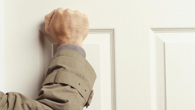 Man knocking on door, (Mid section)