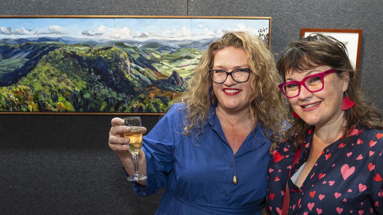 Exhibited artist Kate Marek (left) and her work Binna Burra Outlook with Tianni Fazio at the Fairholme Open Art Prize FACETS exhibition, Friday, May 10, 2024. Picture: Kevin Farmer