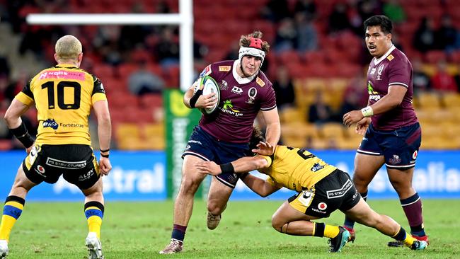 BRISBANE, AUSTRALIA - JULY 17: Fraser McReight of the Reds takes on the defence during the round three Super Rugby AU match between the Reds and Force at Suncorp Stadium on July 17, 2020 in Brisbane, Australia. (Photo by Bradley Kanaris/Getty Images)