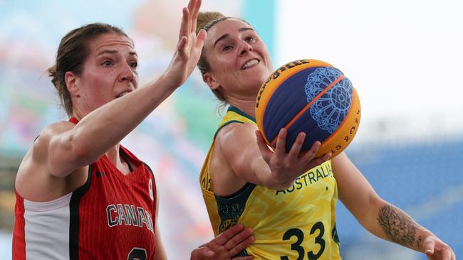 Canada's #02 Katherine Plouffe (L) defends against Australia's #33 Lauren Mansfield in the women's pool round 3x3 basketball game between Australia and Canada during the Paris 2024 Olympic Games at La Concorde in Paris on July 30, 2024. (Photo by David GRAY / AFP)