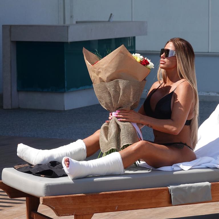 Price with a bouquet of flowers after her holiday accident. Picture: Backgrid