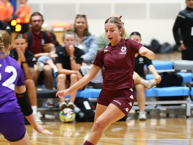 Queensland Maroon open women's player Lucy Rowell n action at the National Futsal Championships. Picture: Graeme Furlong