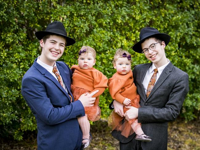 Mendel (left) and Aron Sufrin (right), 17, are non-identical twins and so are their little sisters Raizel and Rivka.