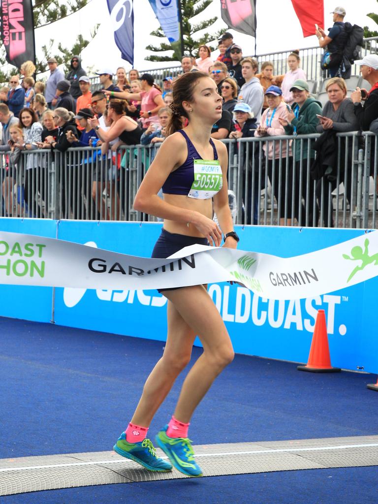 Sayla Donnelley winning the Garmin 4km Junior Dash.