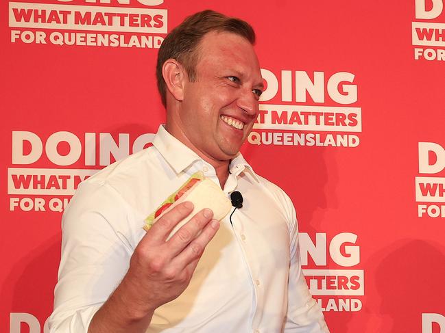 Premier Steven Miles holds his party launch at the North Lakes Community Centre. Premier Miles makes a sandwich with his daughter Bridie 10 on stage. Pics Adam Head