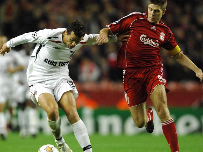 Bobo and Liverpool captain Steven Gerrard compete for the ball.