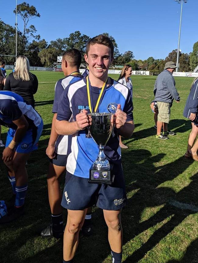 King's Christian College fly half Xavier McEldowney, pictured with the Club U17s trophy for club side Helensvale Hogs. Picture: Supplied